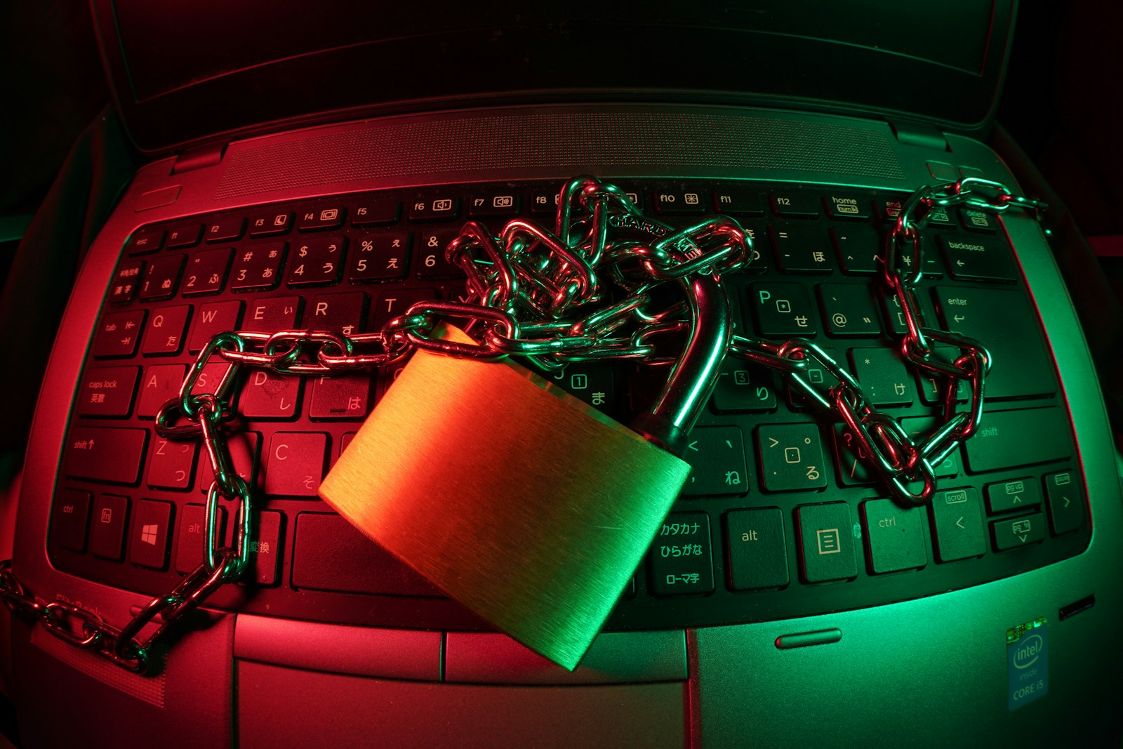 brown padlock on black computer keyboard/ FlyD/ Unsplash